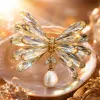 A golden crystal flower brooch is an elegant and retro accessory for women Specification image